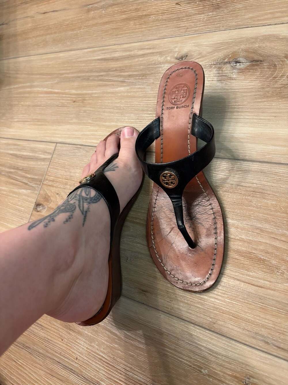 Tory Burch Black Leather Thong Wedge Sandals With Gold Logo Medallion